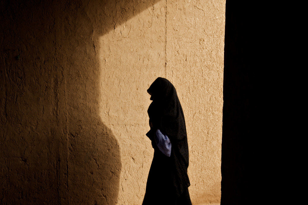 A woman walks through a corridor in a village in Afghanistan. (file)